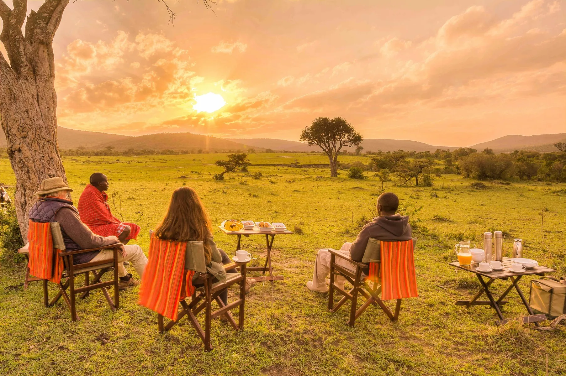 People having a wellness retreat in an african savannah